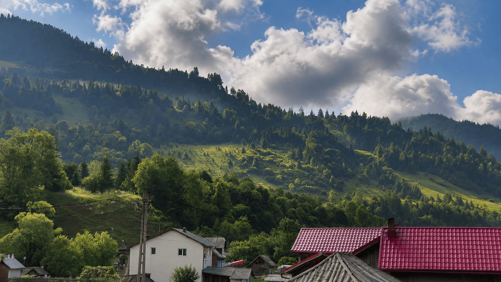Hills around the village, mist on the trees